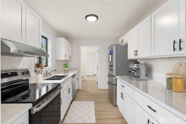 18771 Harris Ave NE, Suquamish, WA 98392 - kitchen featuring appliances with stainless steel finishes, extractor fan, a sink, and white cabinets