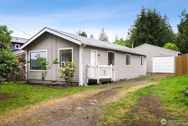 18771 Harris Ave NE, Suquamish, WA 98392 - ranch-style home with driveway, fence, a detached garage, and an outbuilding