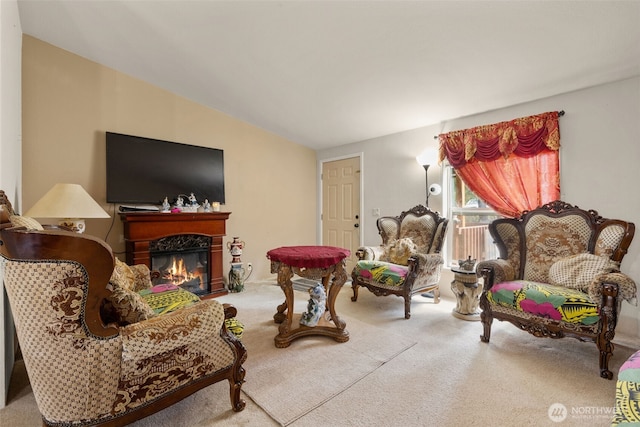 300 E Skookum Dr NE, Shelton, WA 98584 - living room with carpet floors, a glass covered fireplace, and vaulted ceiling