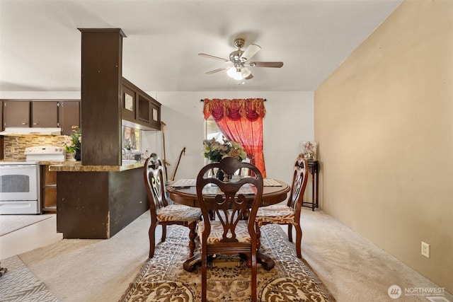 300 E Skookum Dr NE, Shelton, WA 98584 - dining room featuring light colored carpet and a ceiling fan