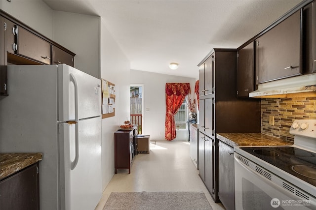 300 E Skookum Dr NE, Shelton, WA 98584 - kitchen with white appliances, under cabinet range hood, backsplash, light floors, and dark countertops