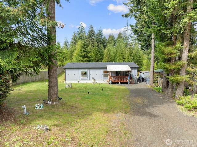 300 E Skookum Dr NE, Shelton, WA 98584 - manufactured / mobile home featuring dirt driveway and a deck