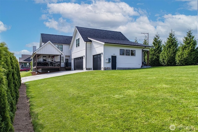 1774 Farmview Ter, Lynden, WA 98264 - view of front of property with driveway, a front lawn, a shingled roof, board and batten siding, and a garage
