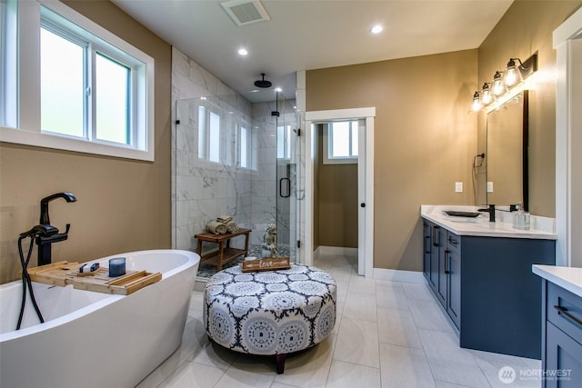 1774 Farmview Ter, Lynden, WA 98264 - full bathroom featuring a stall shower, vanity, a freestanding tub, baseboards, and recessed lighting