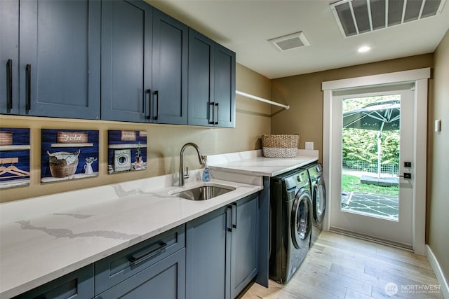 1774 Farmview Ter, Lynden, WA 98264 - clothes washing area featuring cabinet space, separate washer and dryer, light wood-type flooring, baseboards, and recessed lighting