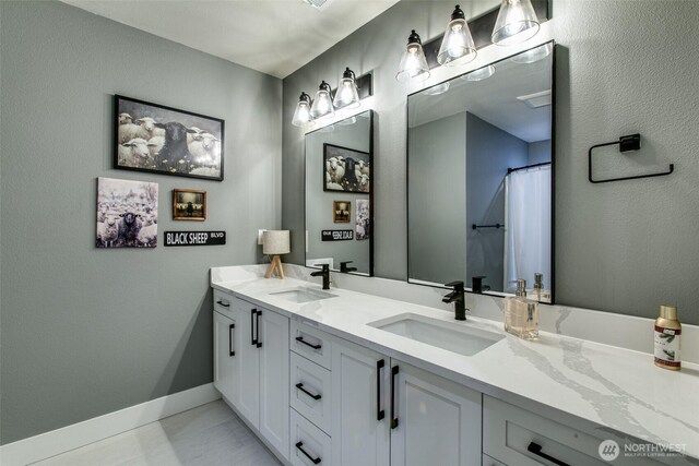 1774 Farmview Ter, Lynden, WA 98264 - bathroom featuring double vanity and baseboards