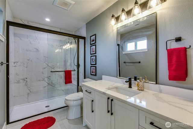 1774 Farmview Ter, Lynden, WA 98264 - bathroom featuring a marble finish shower, toilet, vanity, and recessed lighting