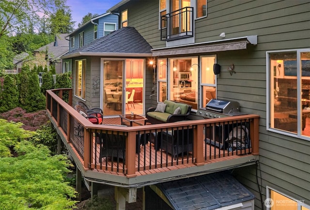 wooden terrace featuring area for grilling