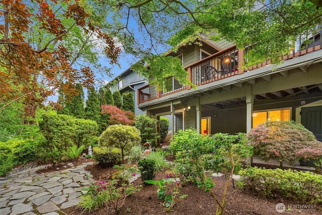 back of property featuring a balcony