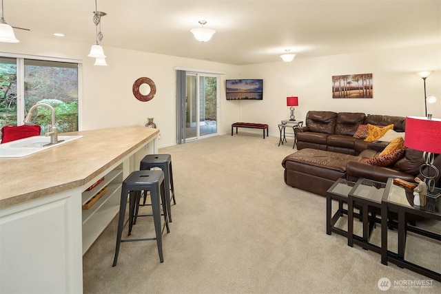 living room featuring light carpet and plenty of natural light