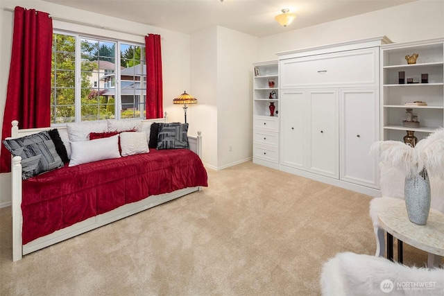 bedroom featuring carpet floors and baseboards