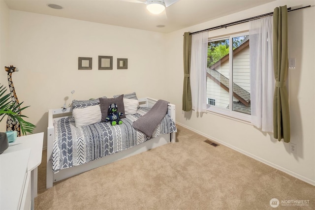 carpeted bedroom featuring baseboards