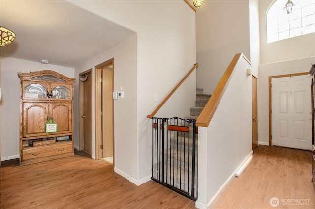 1431 Chatham Dr SE, Olympia, WA 98513 - foyer entrance with light wood-type flooring, baseboards, and stairs