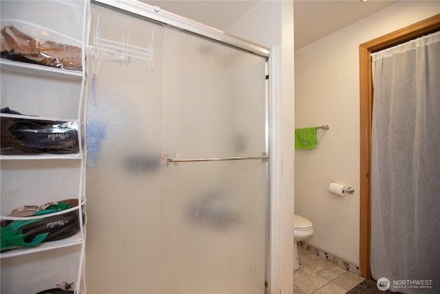 1431 Chatham Dr SE, Olympia, WA 98513 - full bathroom with a shower stall, toilet, and tile patterned flooring