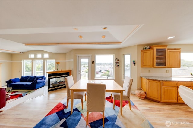 dining room with light wood-style flooring and recessed lighting