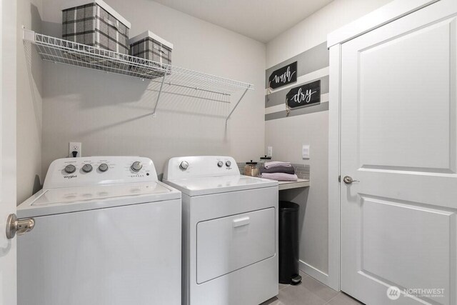 13213 164th Ave SE Unit 205, Renton, WA 98059 - clothes washing area with washer and clothes dryer and light tile patterned flooring