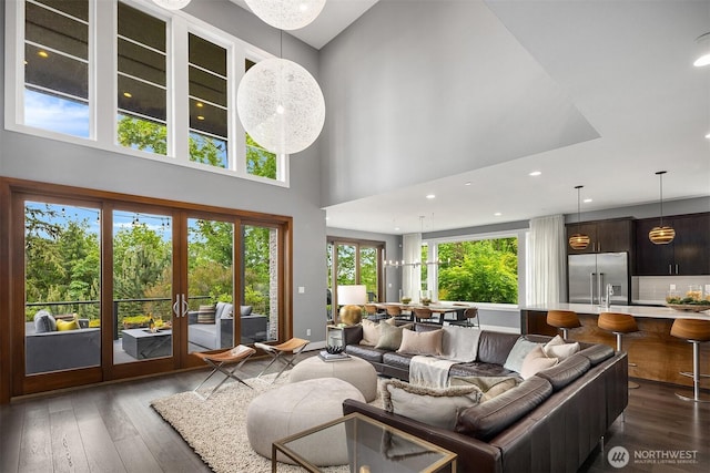 8326 84th Ave SE, Mercer Island, WA 98040 - living room featuring hardwood / wood-style floors, a towering ceiling, french doors, baseboards, and recessed lighting