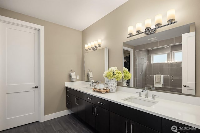 8326 84th Ave SE, Mercer Island, WA 98040 - full bathroom with double vanity, wood finished floors, a shower stall, and baseboards