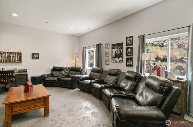 home theater room with carpet floors, healthy amount of natural light, and recessed lighting
