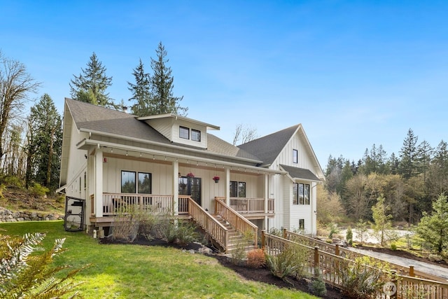 15403 127th Ave SE, Snohomish, WA 98290 - view of front of property featuring covered porch, a front yard, board and batten siding, roof with shingles, and stairs