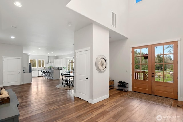 15403 127th Ave SE, Snohomish, WA 98290 - foyer featuring light wood finished floors, recessed lighting, french doors, baseboards, and a high ceiling