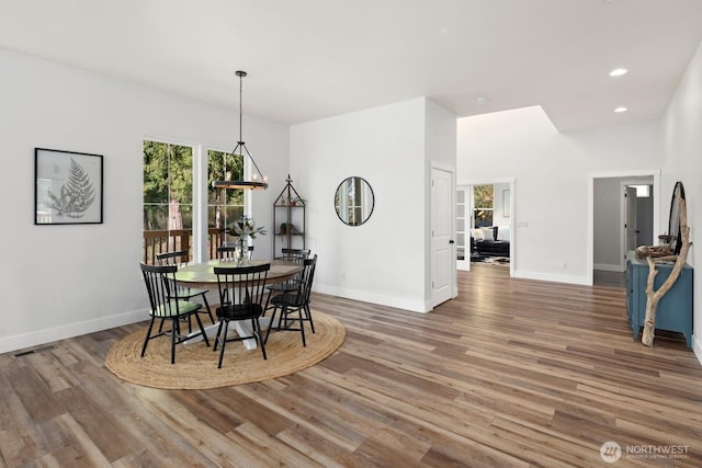 15403 127th Ave SE, Snohomish, WA 98290 - dining area with wood finished floors, baseboards, a chandelier, and recessed lighting