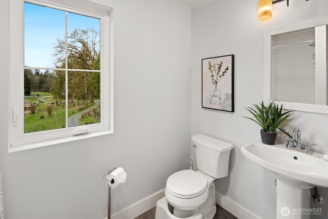 15403 127th Ave SE, Snohomish, WA 98290 - bathroom featuring toilet, baseboards, and a sink