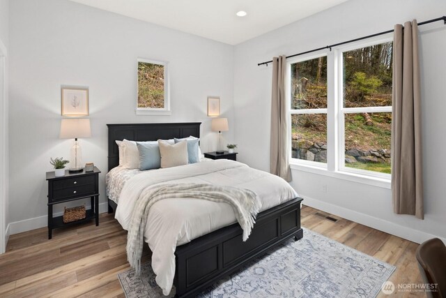 15403 127th Ave SE, Snohomish, WA 98290 - bedroom featuring baseboards, light wood-type flooring, and recessed lighting