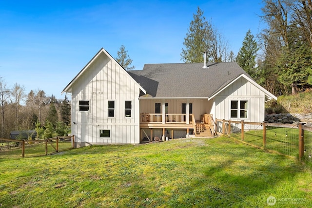 15403 127th Ave SE, Snohomish, WA 98290 - rear view of house with board and batten siding, a shingled roof, a deck, and a gate