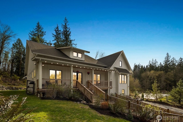 15403 127th Ave SE, Snohomish, WA 98290 - view of front of house featuring a porch, a front lawn, board and batten siding, and stairway