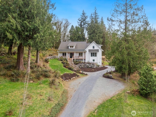15403 127th Ave SE, Snohomish, WA 98290 - view of front facade featuring driveway, covered porch, and stairs