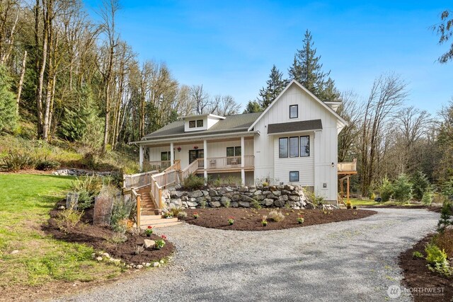 15403 127th Ave SE, Snohomish, WA 98290 - view of front of property featuring a porch, driveway, stairway, and board and batten siding