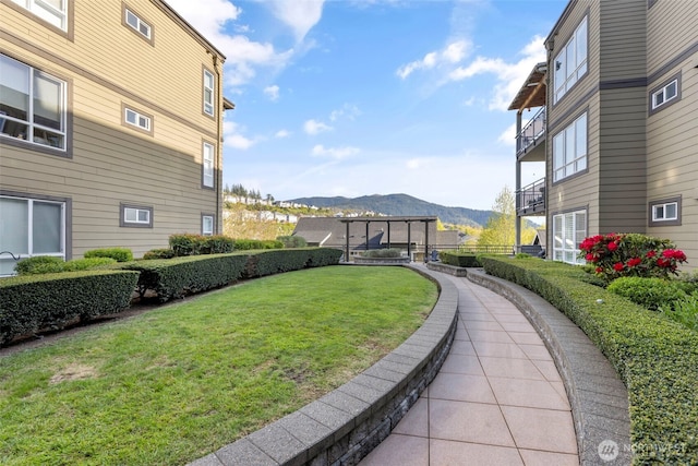 1840 25th Ave NE Unit 308, Issaquah, WA 98029 - view of property's community with a mountain view and a yard
