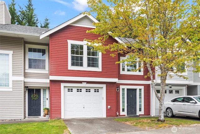 10307 140th Street Ct E Unit 4, Puyallup, WA 98374 - view of property with an attached garage and driveway