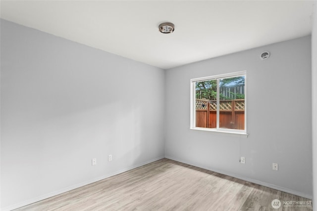 10307 140th Street Ct E Unit 4, Puyallup, WA 98374 - spare room with wood finished floors and baseboards