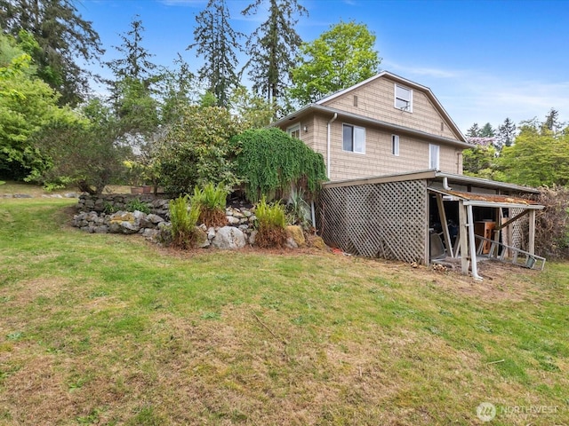 rear view of house with a lawn