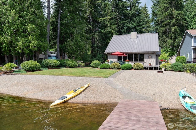 130 E Way To Tipperary St, Shelton, WA 98584 - back of house with a yard, metal roof, a chimney, and a water view