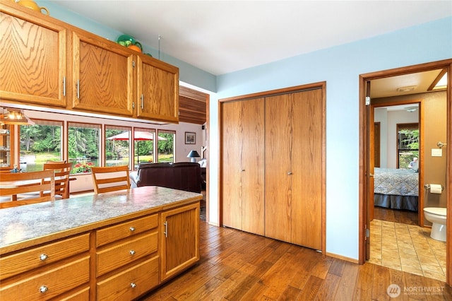 130 E Way To Tipperary St, Shelton, WA 98584 - kitchen with wood finished floors, brown cabinetry, and light countertops
