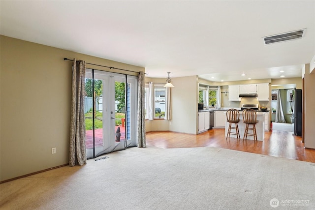 3008 S 365th Ct, Federal Way, WA 98003 - living area featuring light colored carpet, recessed lighting, baseboards, and french doors