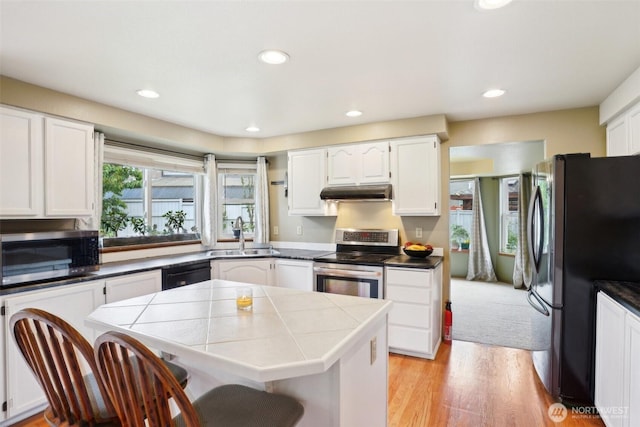 3008 S 365th Ct, Federal Way, WA 98003 - kitchen with appliances with stainless steel finishes, a sink, under cabinet range hood, tile counters, and white cabinets