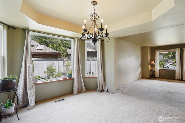 3008 S 365th Ct, Federal Way, WA 98003 - unfurnished dining area featuring carpet flooring, healthy amount of natural light, and a chandelier