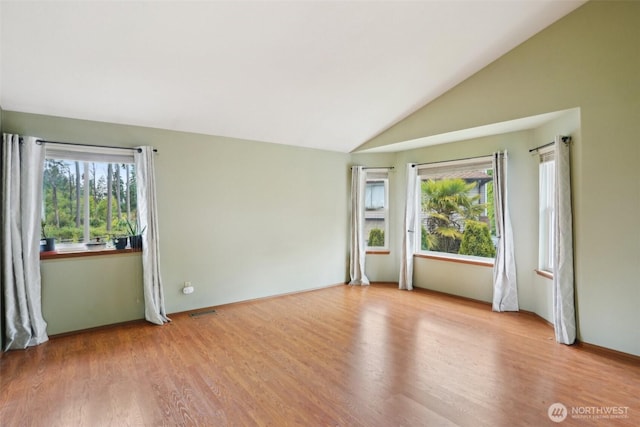 3008 S 365th Ct, Federal Way, WA 98003 - unfurnished room featuring light wood-type flooring and lofted ceiling