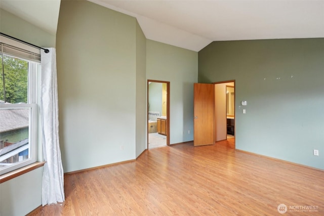 3008 S 365th Ct, Federal Way, WA 98003 - unfurnished bedroom with light wood-type flooring, high vaulted ceiling, and ensuite bathroom