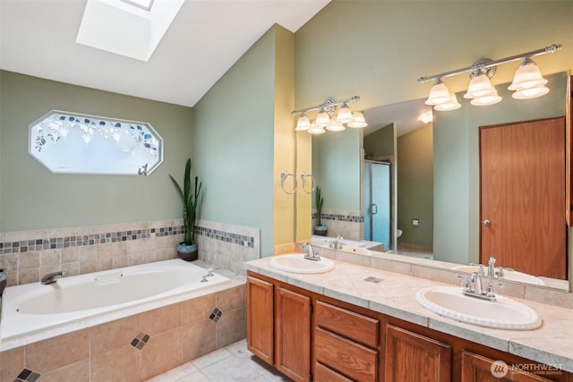 3008 S 365th Ct, Federal Way, WA 98003 - bathroom with a skylight, a garden tub, a stall shower, double vanity, and lofted ceiling