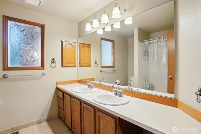 3008 S 365th Ct, Federal Way, WA 98003 - full bathroom with double vanity, tile patterned flooring, toilet, curtained shower, and baseboards