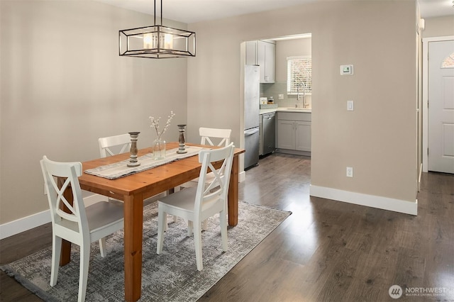 12024 101st Ave NE Unit E3, Kirkland, WA 98034 - dining area featuring dark wood-style flooring and a chandelier