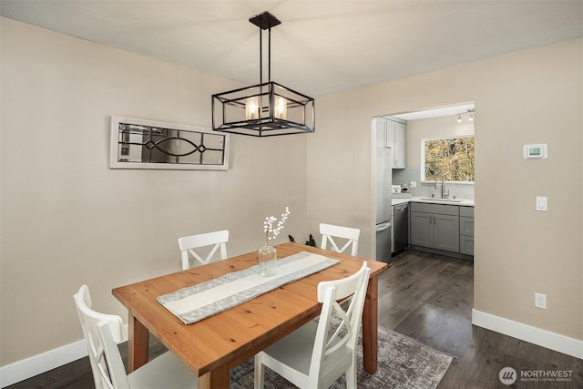 12024 101st Ave NE Unit E3, Kirkland, WA 98034 - dining area with a chandelier and dark wood-style floors
