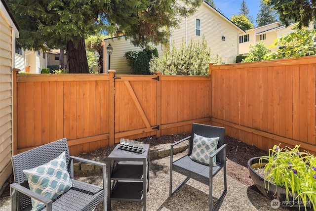 12024 101st Ave NE Unit E3, Kirkland, WA 98034 - fenced backyard with a gate and a patio area