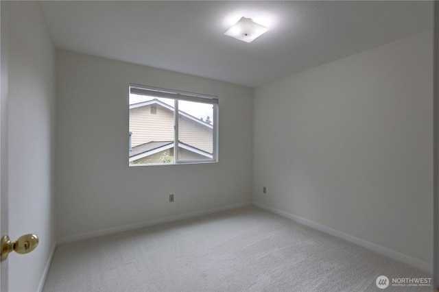 empty room with carpet flooring and baseboards