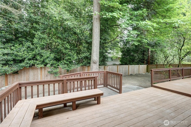 deck with a fenced backyard